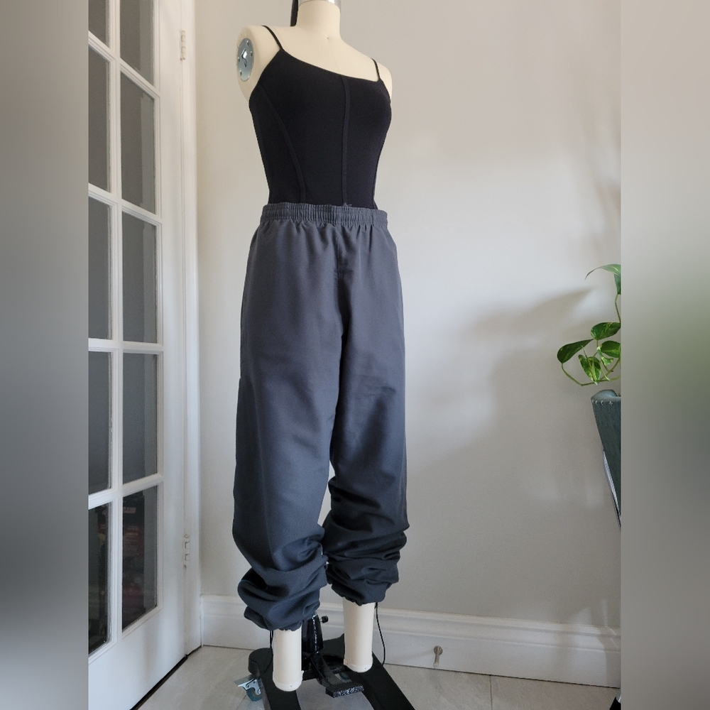 REEBOK Y2K style windbreaker track pants with blue piping, drawstring hem